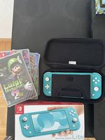 Nintendo Switch Lite Bundle + 7 Spiele + Reisetasche