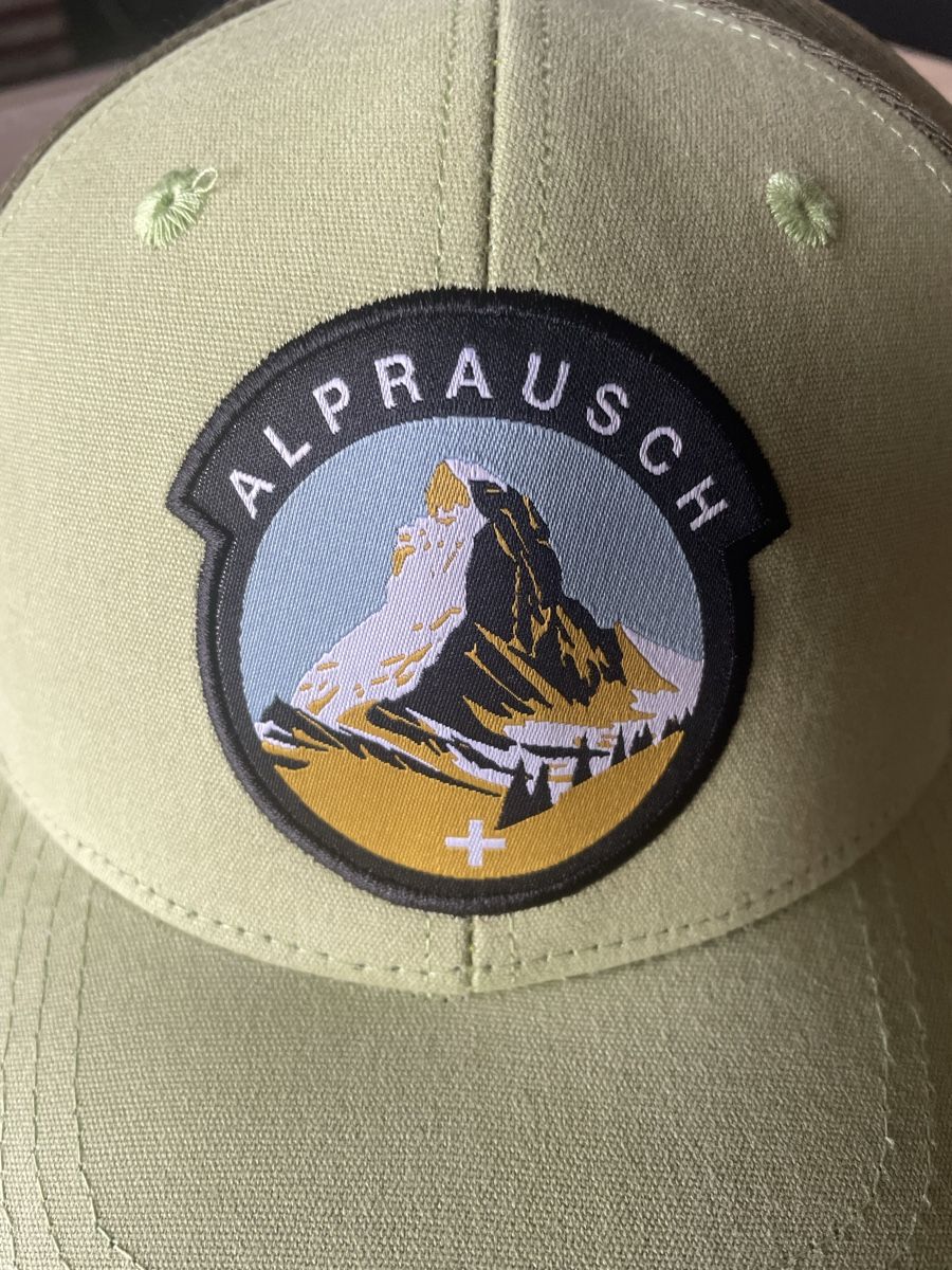 Alprausch Hüte, Mützen & Caps: Cappellino trucker verde con stemma Alprausch – Neu und originalverpackt aus Fully von thg_dcv9 1