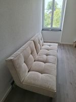 Canapé-lit beige doux et confortable