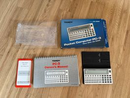 Calculatrice de poche Tandy PC-3,  étui + boit + manuel