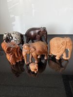 Sechs Elefanten Figuren aus Holz verschiedene Groessen