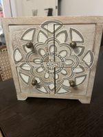 Wooden chest of drawers with mandala pattern