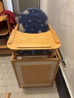 Gebrauchter Kinderhochstuhl aus Holz mit Kissenbezug