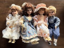 Porzellanpuppen Set 4 Stück verschiedene Kleider gebraucht