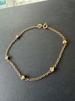 Bracelet chaîne avec petits coeur en Or 750