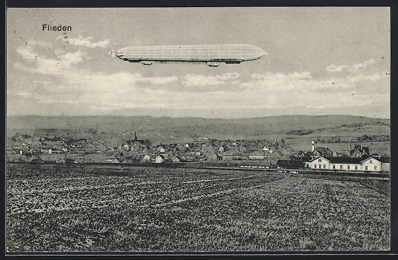 Cartoline postali: AK Flieden, Zeppelin über der Ortschaft – Usato da Berlin venduto da bartko-reher