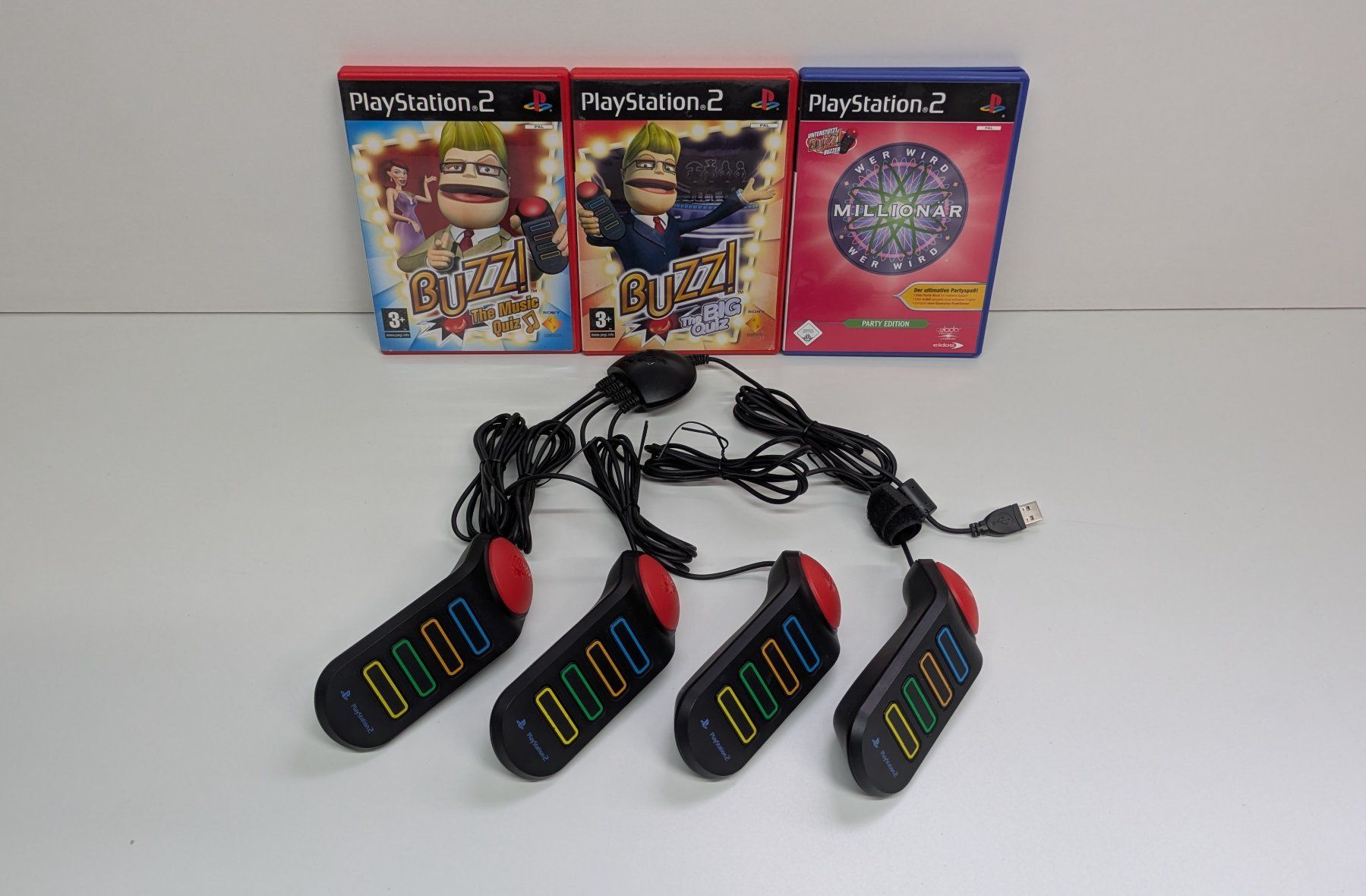 Spiele: 4 PlayStation Buzzer mit 3 Quiz-Games, PS2 – Gebraucht aus Menziken von mame18