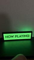 Enseigne lumineuse "Now Playing" LED L58xH18