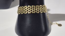 Bracciale dorato a maglia larga con estensore