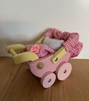 herziger Puppenwagen für die Puppenstube rosa/gelb aus Holz