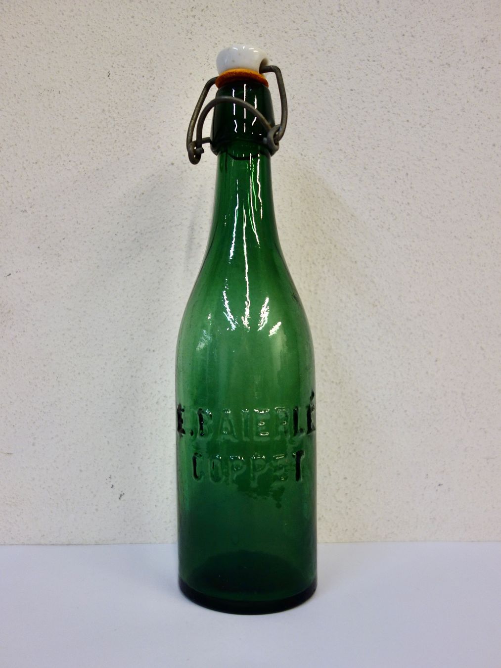 Bicchieri, Caraffe & Bottiglie: kleine alte Flasche E. BAIERLÉ COPPET – Usato da Kerzers venduto da Flaschenposten