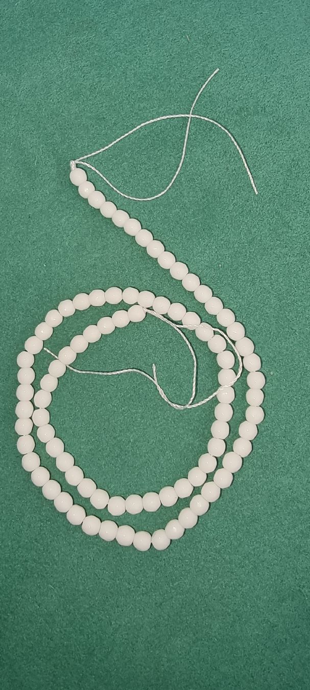 Minerali & Pietre curative: Onyx weiss 4mm. facettiert Strang – Nuovo e nell'imballaggio originale da Menziken venduto da Mirager 1