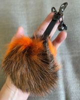 Taschenanhänger Fell Bommel orange schwarz braun
