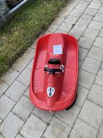 Roter Hamax Rodelschlitten mit Lenkrad - Winterspass!
