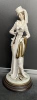 Elegante Porzellan-Damenfigur, von Bruno Merli