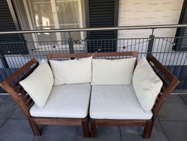 Wooden outdoor sofa with white cushions, good condition