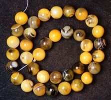 1 Strang sehr schöne gelb-schwarze Achat Perlen 10 mm