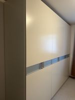Large beige wardrobe with sliding doors