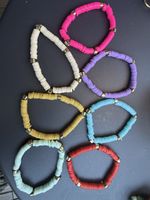 Set of colourful beaded bracelets new unused - 7 units 