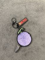 Porte-clés One Piece fruit du démon violet neuf
