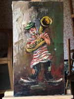 Tableau signé URBAN, le clown musicien.