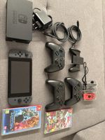 Nintendo Switch Konsole mit Zubehoer und Spielen
