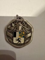 médaille arbore les armoiries du canton des Grisons