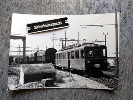 RhB/BM Triebwagen mit Rollschemel-Transport - Foto