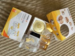 Tire-lait Medela + accessoires