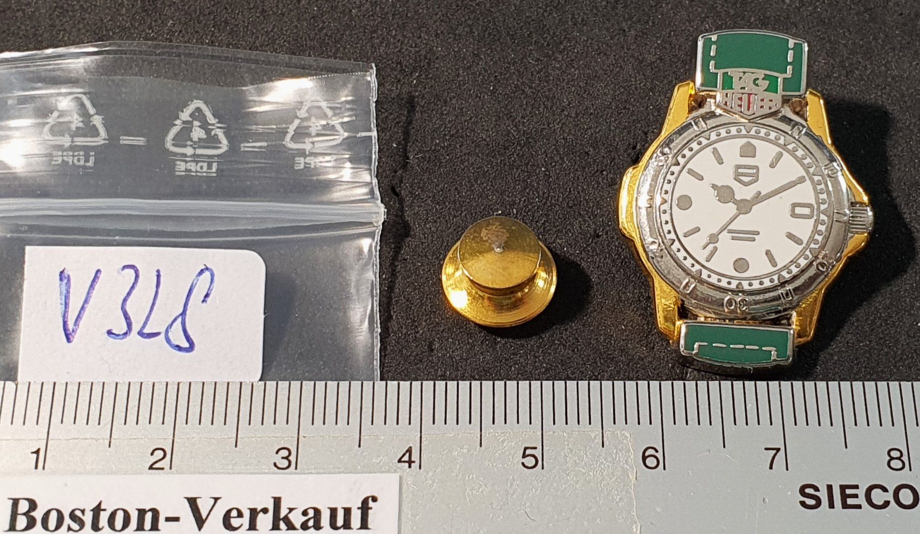 Placchette & Badge: V328 - Pin Uhr Tag Heuer – Usato da Reinach BL venduto da Boston-Verkauf 2