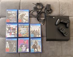 Playstation 4 mit 8 Spielen und Controller-Ladestation