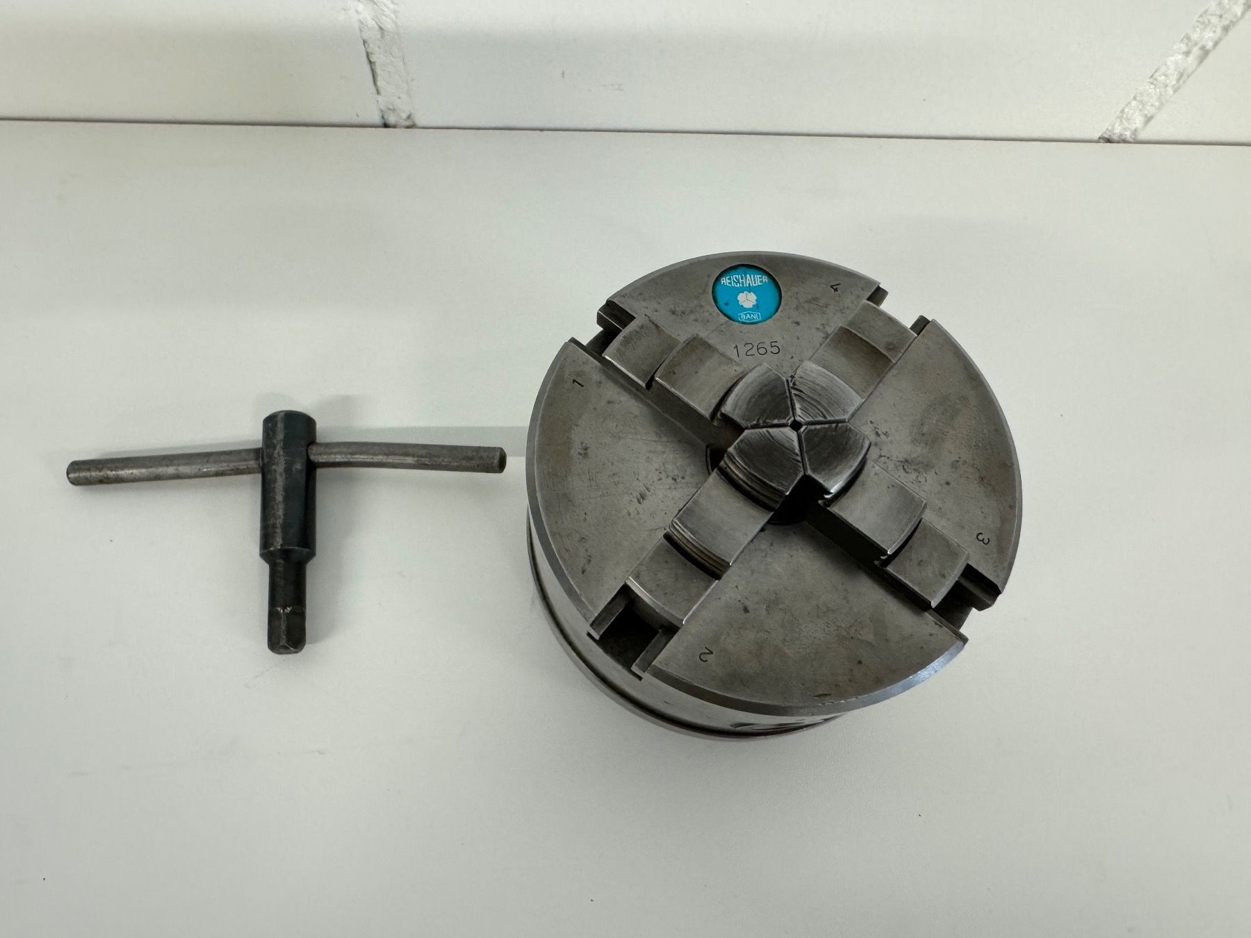 Reishauer Tutti gli attrezzi: Mandrin 4 mors REISHAUER 1265 avec clé, W25 – Usato da Aarberg venduto da SNMachines 2