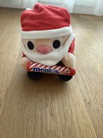 Niedliche Weihnachtsmann Plüschfigur mit Mentos.