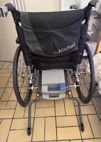 Sedia a rotelle con motore elettrico